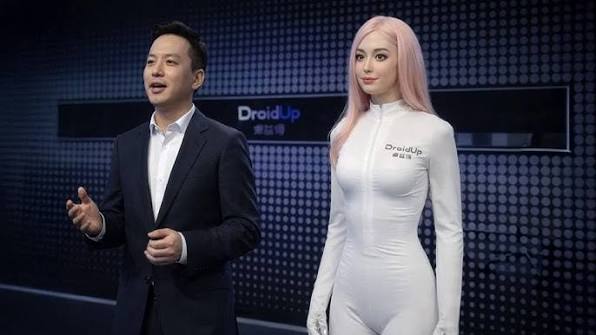 MOYA humanoid dancing with a presenter at the DroidUp reveal